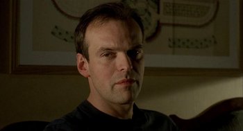 Movie still from “The One and Only” (1999), directed by Susanne Bier – A person wearing a black t - shirt; Close Up shot, Low angle