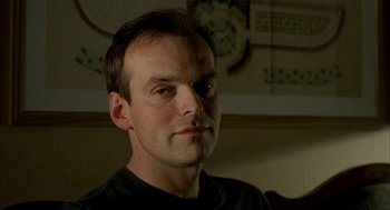 Movie still from “The One and Only” (1999), directed by Susanne Bier – A person wearing a black t - shirt; Close Up shot, Low angle