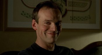 Movie still from “The One and Only” (1999), directed by Susanne Bier – A person smiling for the camera; Close Up shot, Low angle