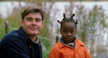 Movie still from “The One and Only” (1999), directed by Susanne Bier – A man standing next to a little girl; Close Up shot, Over the shoulder angle