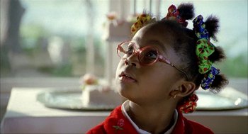 Movie still from “The One and Only” (1999), directed by Susanne Bier – A little girl wearing glasses looking up at the sky; Close Up shot, Low angle