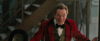 Movie still from “The One and Only Ivan” (2020), directed by Thea Sharrock – A person wearing a suit and bow tie; Close Up shot, Low angle