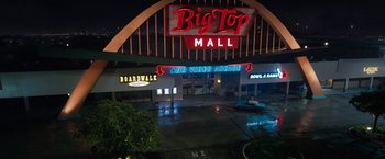Movie still from “The One and Only Ivan” (2020), directed by Thea Sharrock – A big top mall is lit up at night; Extreme Wide shot, High angle