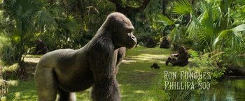 Movie still from “The One and Only Ivan” (2020), directed by Thea Sharrock – A gorilla standing in the middle of a lush green field; Wide shot, High angle