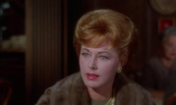 Movie still from “The Oscar” (1966), directed by Russell Rouse – A person wearing a fur coat; Close Up shot, Over the shoulder angle