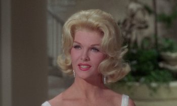 Movie still from “The Oscar” (1966), directed by Russell Rouse – A person wearing a dress; Close Up shot, Low angle