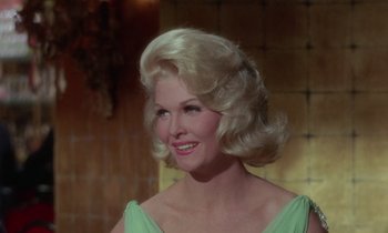 Movie still from “The Oscar” (1966), directed by Russell Rouse – A person wearing a dress; Close Up shot, Low angle