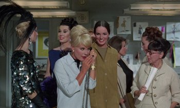 Movie still from “The Oscar” (1966), directed by Russell Rouse – A group of women standing next to each other; Medium shot, Low angle