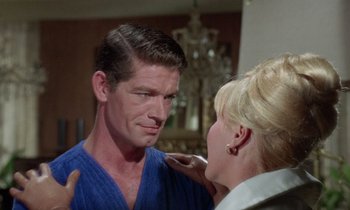 Movie still from “The Oscar” (1966), directed by Russell Rouse – A man and a woman are looking at one another; Close Up shot, Over the shoulder angle