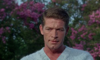 Movie still from “The Oscar” (1966), directed by Russell Rouse – A person wearing a white sweater; Close Up shot, Low angle