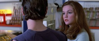Movie still from “The Outsiders” (1983), directed by Francis Ford Coppola – A young man and a young woman talking to each other; Close Up shot, Over the shoulder angle