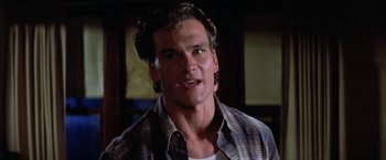 Movie still from “The Outsiders” (1983), directed by Francis Ford Coppola – A person wearing a plaid shirt; Close Up shot, Low angle
