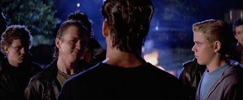 Movie still from “The Outsiders” (1983), directed by Francis Ford Coppola – A man and a woman looking at each other; Close Up shot, Over the shoulder angle