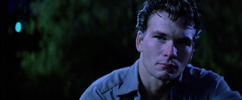 Movie still from “The Outsiders” (1983), directed by Francis Ford Coppola – A person wearing a blue shirt; Close Up shot, Low angle