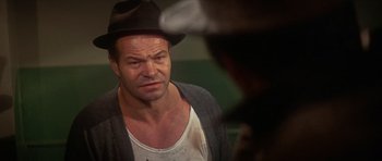 Movie still from “The Owl and the Pussycat” (1970), directed by Herbert Ross – A person wearing a hat; Close Up shot, Over the shoulder angle