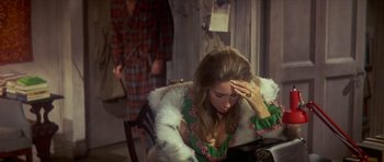 Movie still from “The Owl and the Pussycat” (1970), directed by Herbert Ross – A woman sitting in front of a man in a fur coat; Medium shot, High angle