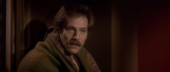 Movie still from “The Owl and the Pussycat” (1970), directed by Herbert Ross – A person with a beard and mustache; Close Up shot, High angle