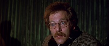 Movie still from “The Owl and the Pussycat” (1970), directed by Herbert Ross – A person wearing glasses and a beard; Close Up shot, Low angle