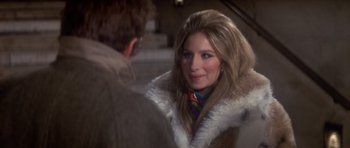 Movie still from “The Owl and the Pussycat” (1970), directed by Herbert Ross – A woman wearing a fur coat talking to a man; Close Up shot, Over the shoulder angle