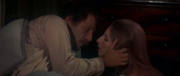 Movie still from “The Owl and the Pussycat” (1970), directed by Herbert Ross – A man and a woman are looking into each others eyes; Close Up shot, High angle