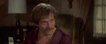 Movie still from “The Owl and the Pussycat” (1970), directed by Herbert Ross – A person with a mustache; Close Up shot, High angle