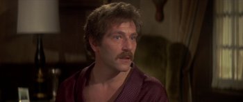 Movie still from “The Owl and the Pussycat” (1970), directed by Herbert Ross – A person with a mustache; Close Up shot, High angle