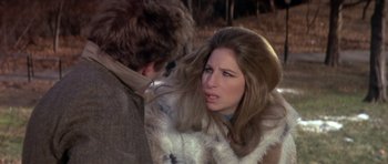 Movie still from “The Owl and the Pussycat” (1970), directed by Herbert Ross – A man and a woman in a fur coat; Close Up shot, Over the shoulder angle