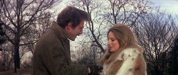 Movie still from “The Owl and the Pussycat” (1970), directed by Herbert Ross – A man and a woman are holding hands; Medium shot, Over the shoulder angle