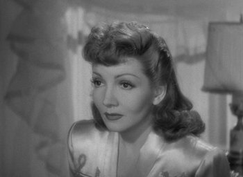 Movie still from “The Palm Beach Story” (1942), directed by Preston Sturges – An old black and white photo of a woman; Close Up shot, High angle