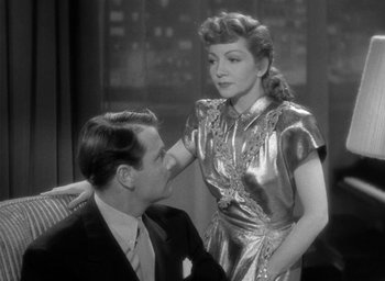 Movie still from “The Palm Beach Story” (1942), directed by Preston Sturges – A man and a woman are sitting in a room together; Medium shot, Over the shoulder angle