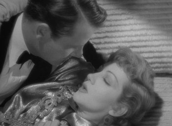 Movie still from “The Palm Beach Story” (1942), directed by Preston Sturges – A man and a woman laying on the ground; Close Up shot, Overhead angle