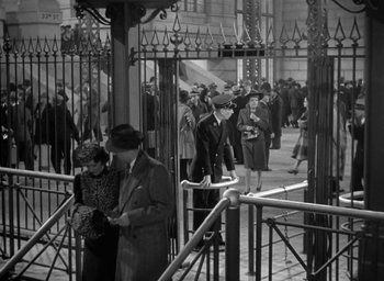 Movie still from “The Palm Beach Story” (1942), directed by Preston Sturges – An old black and white photo of a crowd of people; Wide shot, High angle