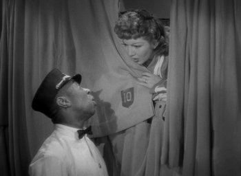 Movie still from “The Palm Beach Story” (1942), directed by Preston Sturges – A black and white photo of a man and a woman; Medium shot, High angle