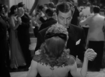 Movie still from “The Palm Beach Story” (1942), directed by Preston Sturges – A man and a woman are dancing in a ballroom; Medium shot, Over the shoulder angle