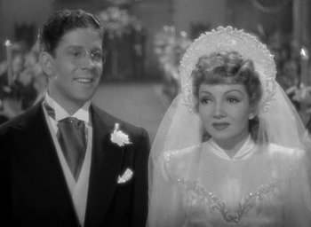 Movie still from “The Palm Beach Story” (1942), directed by Preston Sturges – A black and white photo of a man and a woman; Medium shot, High angle