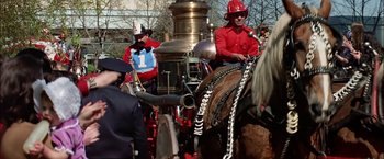 Movie still from “The Parallax View” (1974), directed by Alan J. Pakula – A group of men riding on the back of horses; Medium shot, Low angle