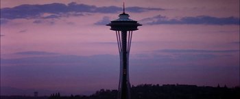 Movie still from “The Parallax View” (1974), directed by Alan J. Pakula – The space needle is lit up at night; Extreme Wide shot, Low angle