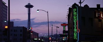 Movie still from “The Parallax View” (1974), directed by Alan J. Pakula – A view of a city at night from the street; Extreme Wide shot, Low angle
