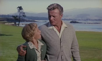 Movie still from “The Parent Trap” (1961), directed by David Swift – A man and a woman standing next to each other; Medium shot, Low angle