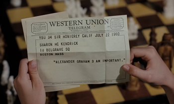 Movie still from “The Parent Trap” (1961), directed by David Swift – A person holding up a telegram on top of a chess board; Extreme Close Up shot, High angle
