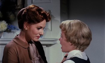 Movie still from “The Parent Trap” (1961), directed by David Swift – A woman and a young boy talking to each other; Close Up shot, Over the shoulder angle