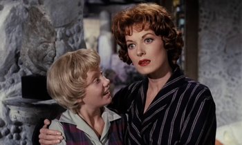 Movie still from “The Parent Trap” (1961), directed by David Swift – A woman and a boy standing next to each other; Close Up shot, Over the shoulder angle