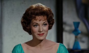 Movie still from “The Parent Trap” (1961), directed by David Swift – A person wearing a blue dress; Close Up shot, High angle