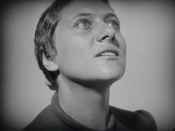 Movie still from “The Passion of Joan of Arc” (1928), directed by Carl Theodor Dreyer – Black and white photograph of a woman looking up; Close Up shot, Low angle