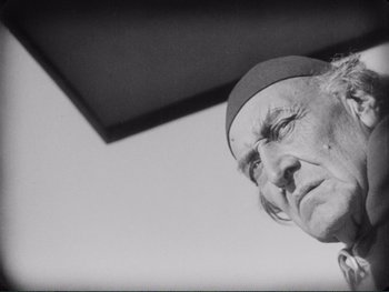 Movie still from “The Passion of Joan of Arc” (1928), directed by Carl Theodor Dreyer – An old man looking up at the sky; Close Up shot, Low angle