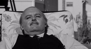 Movie still from “The Pawnbroker” (1964), directed by Sidney Lumet – An older man laying in a chair with his eyes wide open; Close Up shot, High angle