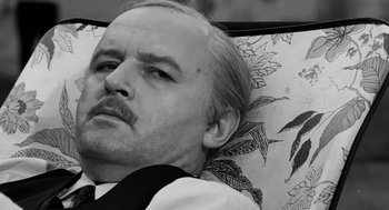 Movie still from “The Pawnbroker” (1964), directed by Sidney Lumet – Black and white photograph of a man with a mustache; Close Up shot, Low angle
