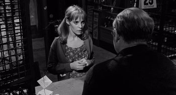 Movie still from “The Pawnbroker” (1964), directed by Sidney Lumet – A black and white photo of a woman talking to a man; Medium shot, Over the shoulder angle
