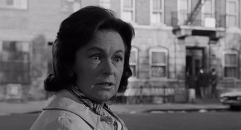 Movie still from “The Pawnbroker” (1964), directed by Sidney Lumet – An older woman is looking into the distance; Close Up shot, Low angle