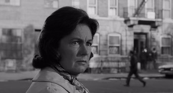 Movie still from “The Pawnbroker” (1964), directed by Sidney Lumet – An older woman is looking into the distance; Close Up shot, Low angle